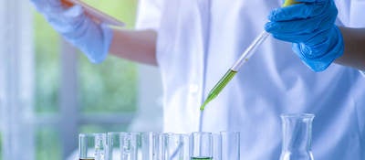 Scientist working in a chemical laboratory and using test tubes